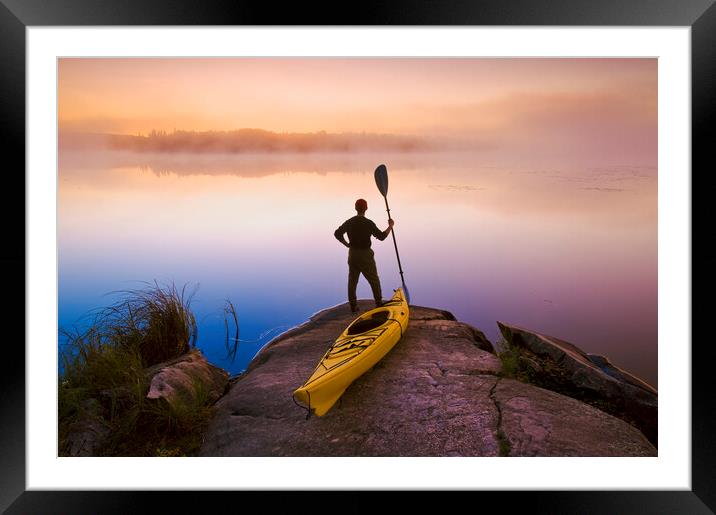 man with kayak Framed Mounted Print by Dave Reede
