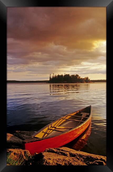 canoe on Nutimik Lake Framed Print by Dave Reede
