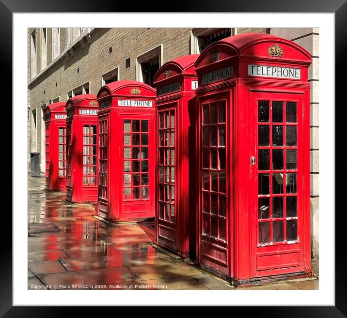 A chorus of red telephone boxes, London Framed Mounted Print by Fiona Smallcorn