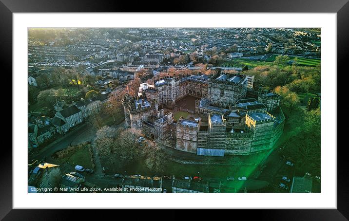 Aerial view of a historic Lancaster castle at sunset with surrounding greenery and urban backdrop. Framed Mounted Print by Man And Life
