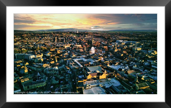 Aerial view of a city Lancaster at sunset with warm lighting, showcasing urban architecture and a distant horizon under a colorful sky. Framed Mounted Print by Man And Life