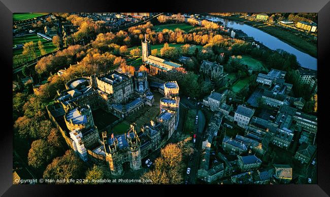 Aerial view of a historic Lancaster castle surrounded by greenery and a river at sunset. Framed Print by Man And Life