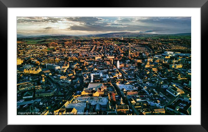 Aerial view of a city Lancaster at sunset with warm lighting, showcasing urban architecture and streets. Framed Mounted Print by Man And Life