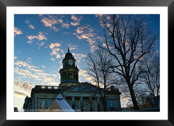 Historic building with clock tower at dusk, silhouetted trees in foreground, pink clouds in blue sky in Lancaster. Framed Mounted Print by Man And Life