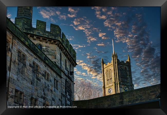 Historic stone buildings with towers against a dramatic sky at dusk in Lancaster. Framed Print by Man And Life