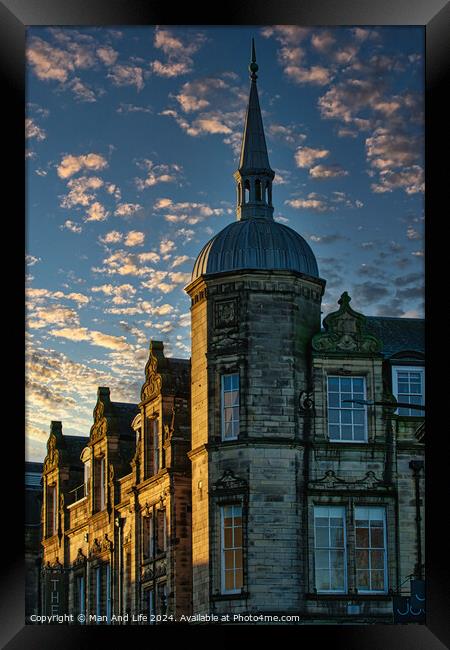 Historic stone building with a spire against a dramatic sky with golden sunset clouds in Lancaster. Framed Print by Man And Life