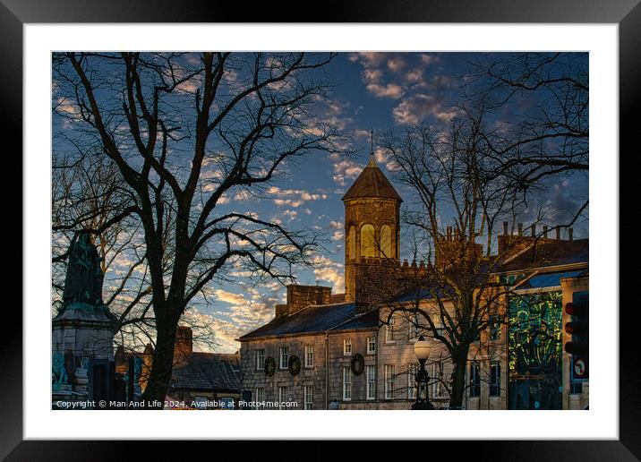 Historic stone building with a clock tower at dusk, silhouetted trees, and a vibrant sky in Lancaster. Framed Mounted Print by Man And Life