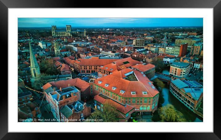 Aerial view of a historic city at dusk with prominent buildings and a clear sky in York, North Yorkshire Framed Mounted Print by Man And Life