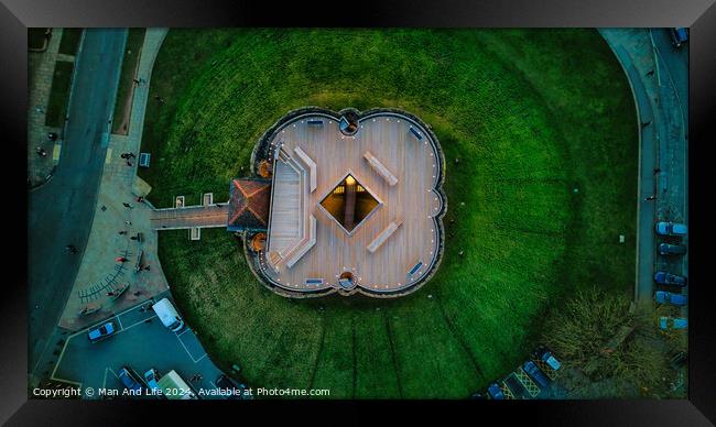 Aerial view of a unique star-shaped building surrounded by green lawns at dusk in York, North Yorkshire Framed Print by Man And Life