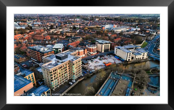 Aerial view of a modern urban cityscape at dusk with buildings and roads in York, North Yorkshire Framed Mounted Print by Man And Life