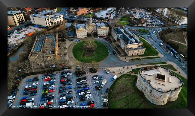 Aerial view of a historic city center with old buildings, a park, and a parking lot at dusk in York, North Yorkshire Framed Print by Man And Life
