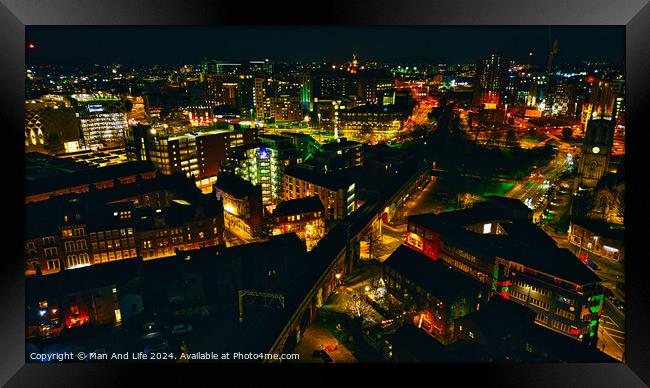 Aerial night view of a vibrant cityscape with illuminated streets and buildings in Leeds, UK. Framed Print by Man And Life