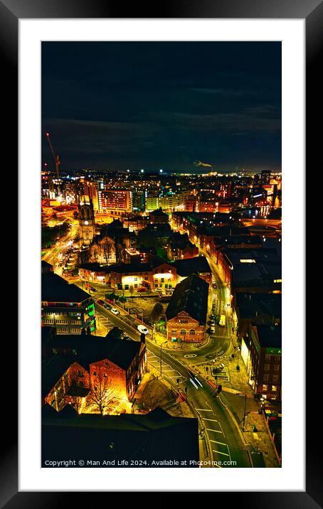 Aerial night view of a cityscape with illuminated streets and buildings, showcasing urban architecture in Leeds, UK. Framed Mounted Print by Man And Life
