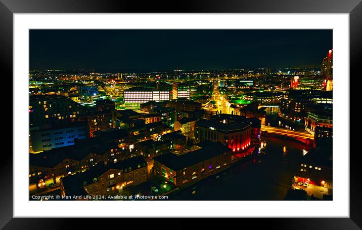 Aerial night view of a vibrant cityscape with illuminated buildings and streets in Leeds, UK. Framed Mounted Print by Man And Life
