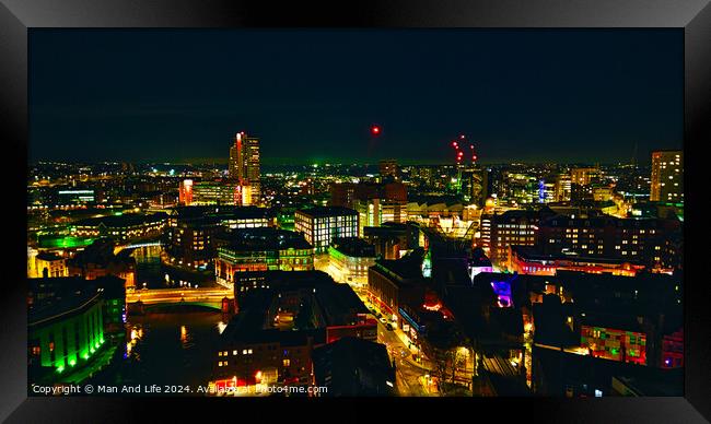 City skyline at night with illuminated buildings and vibrant urban lights in Leeds, UK. Framed Print by Man And Life