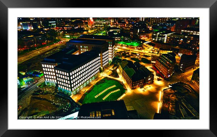 Aerial night view of an illuminated urban landscape with buildings and streets in Leeds, UK. Framed Mounted Print by Man And Life