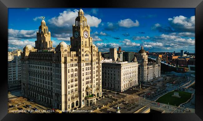 Dramatic skyline with historic buildings under a cloudy blue sky in Liverpool, UK. Framed Print by Man And Life