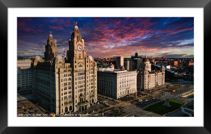 Aerial view of iconic Liverpool waterfront buildings at sunset with dramatic sky. Framed Mounted Print by Man And Life