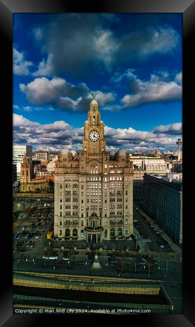 Dramatic sky over historic clock tower building in urban landscape in Liverpool, UK. Framed Print by Man And Life