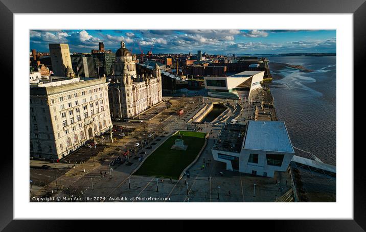 Aerial view of a cityscape with historic buildings and modern architecture near a river under a cloudy sky in Liverpool, UK. Framed Mounted Print by Man And Life
