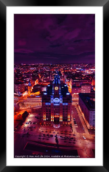 Aerial night view of a cityscape with illuminated buildings under a purple sky in Liverpool, UK. Framed Mounted Print by Man And Life