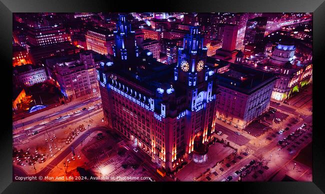 Aerial night view of an illuminated historic building in an urban setting with city lights in Liverpool, UK. Framed Print by Man And Life