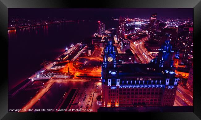 Aerial night view of a vibrant cityscape with illuminated streets and buildings in Liverpool, UK. Framed Print by Man And Life