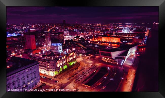 Aerial night view of a vibrant cityscape with illuminated streets and buildings in Liverpool, UK. Framed Print by Man And Life