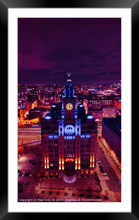Aerial night view of an illuminated historic building in an urban landscape with vibrant purple skies in Liverpool, UK. Framed Mounted Print by Man And Life