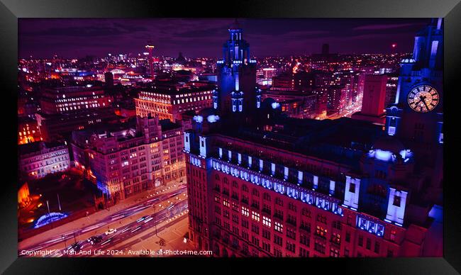 Aerial night view of a vibrant cityscape with illuminated buildings and streets in Liverpool, UK. Framed Print by Man And Life