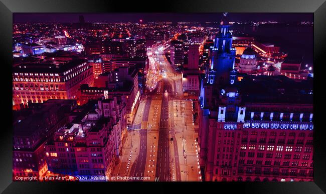 Aerial night view of a bustling cityscape with illuminated streets and urban architecture in Liverpool, UK. Framed Print by Man And Life