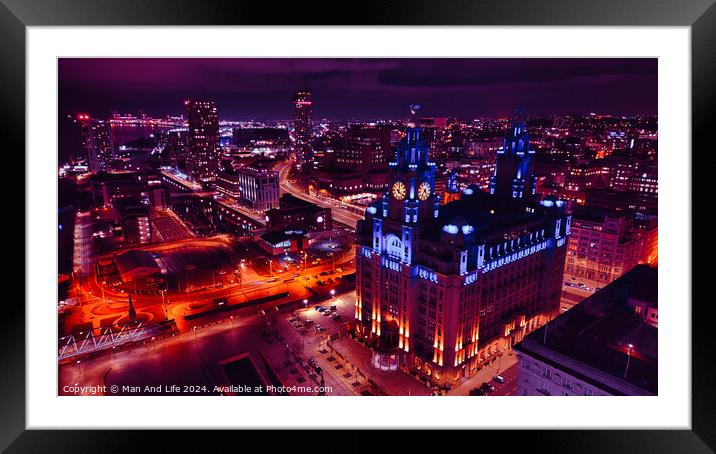 Night cityscape with illuminated buildings and streets, showcasing urban architecture and vibrant nightlife in Liverpool, UK. Framed Mounted Print by Man And Life
