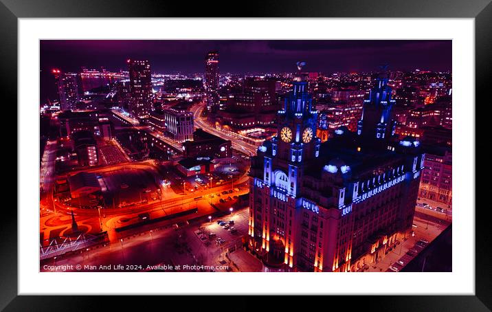 Aerial night view of a vibrant cityscape with illuminated streets and an iconic building in Liverpool, UK. Framed Mounted Print by Man And Life