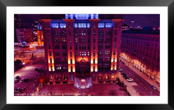 Dramatic night view of an illuminated urban building with a purple sky backdrop in Liverpool, UK. Framed Mounted Print by Man And Life