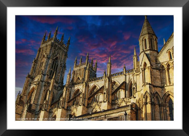 Majestic medieval cathedral against a vibrant sunset sky in York, UK. Framed Mounted Print by Man And Life