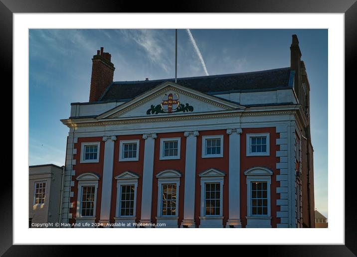 Classic red and white building facade with clear blue sky at dusk in York, UK. Framed Mounted Print by Man And Life