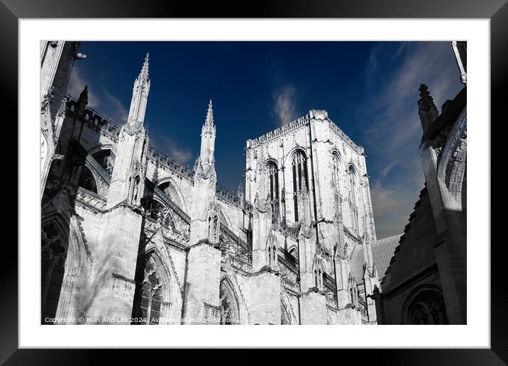 Gothic cathedral architecture with spires against a blue sky with clouds in York, UK. Framed Mounted Print by Man And Life