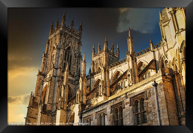 Majestic Gothic cathedral against a dramatic sky at sunset, showcasing intricate architecture and historical grandeur in York, UK. Framed Print by Man And Life