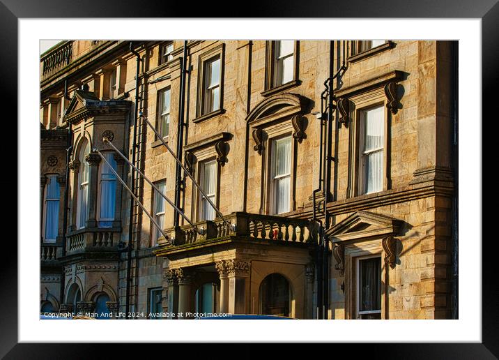 Sunlit classic European architecture with ornate facades and windows in Harrogate, England. Framed Mounted Print by Man And Life