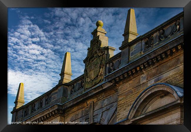 Historic building facade with ornate sculptures against a blue sky with clouds in Harrogate, England. Framed Print by Man And Life