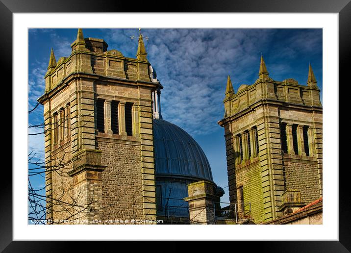 Twin stone towers against a blue sky with dramatic clouds, architectural detail in Harrogate, England. Framed Mounted Print by Man And Life