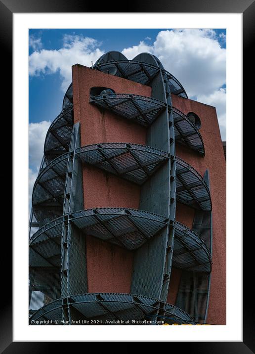 Modern building facade with unique geometric design against a cloudy sky in Leeds, UK. Framed Mounted Print by Man And Life