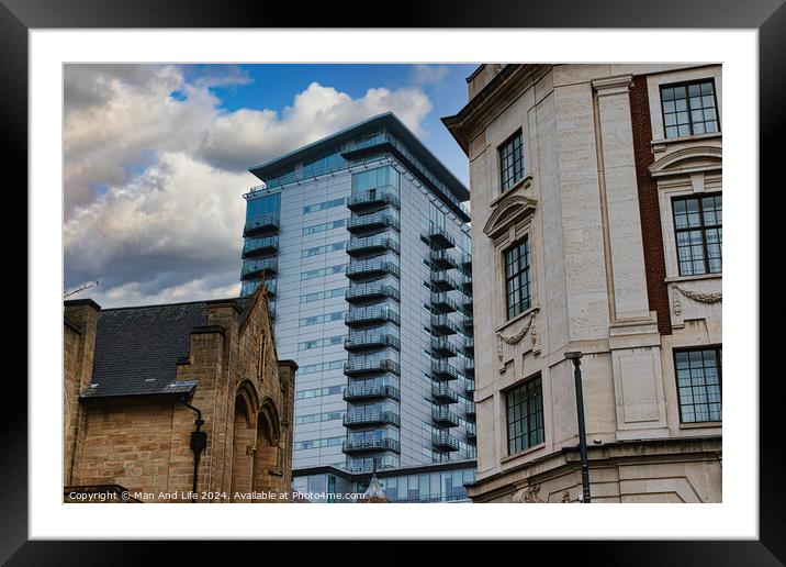 Modern glass skyscraper towering over historic buildings under a cloudy sky in Leeds, UK. Framed Mounted Print by Man And Life