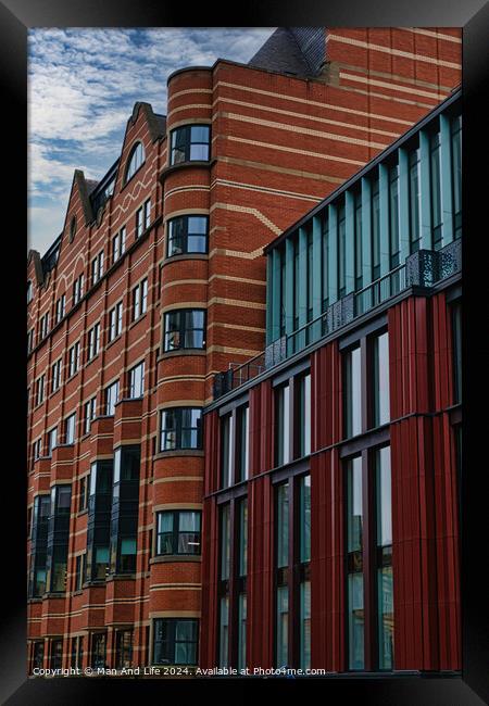 Modern urban architecture with red brick and glass facade against a cloudy sky in Leeds, UK. Framed Print by Man And Life