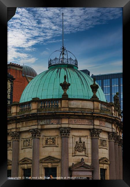 Vintage green dome of a classical building against a blue sky with modern skyscrapers in the background in Leeds, UK. Framed Print by Man And Life