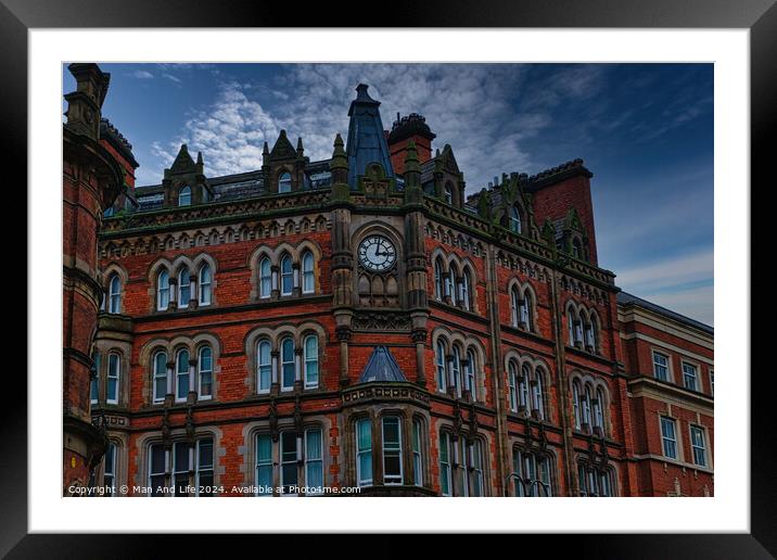 Gothic-style red brick building with clock tower under a moody sky in Leeds, UK. Framed Mounted Print by Man And Life
