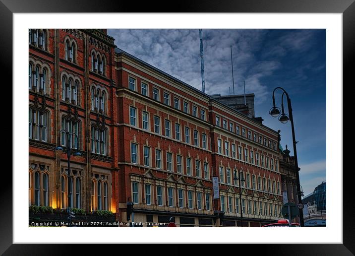 Historic red brick building at dusk with street lamp and dramatic sky in Leeds, UK. Framed Mounted Print by Man And Life