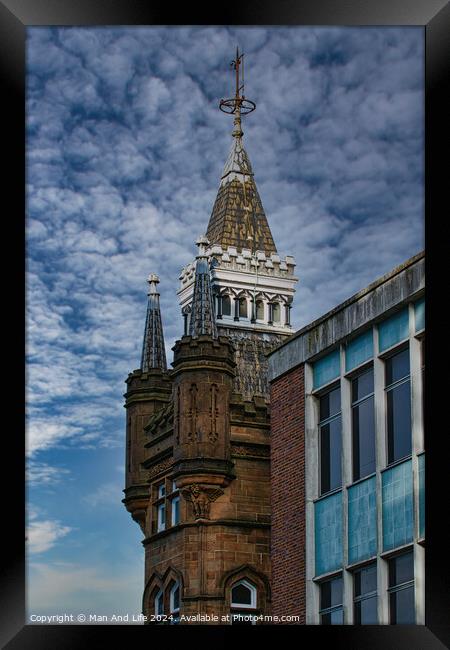 Historic tower with spire against a dramatic cloudy sky, juxtaposed with modern building facade in Leeds, UK. Framed Print by Man And Life