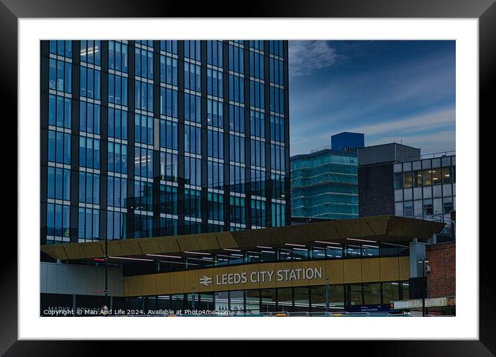 Exterior view of Leeds City Station with modern architecture and signage, under a cloudy sky Framed Mounted Print by Man And Life