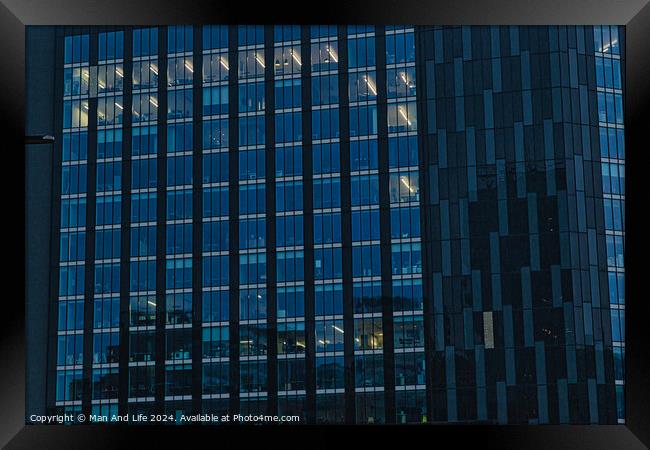Modern office building facade with reflective glass windows at dusk in Leeds, UK. Framed Print by Man And Life